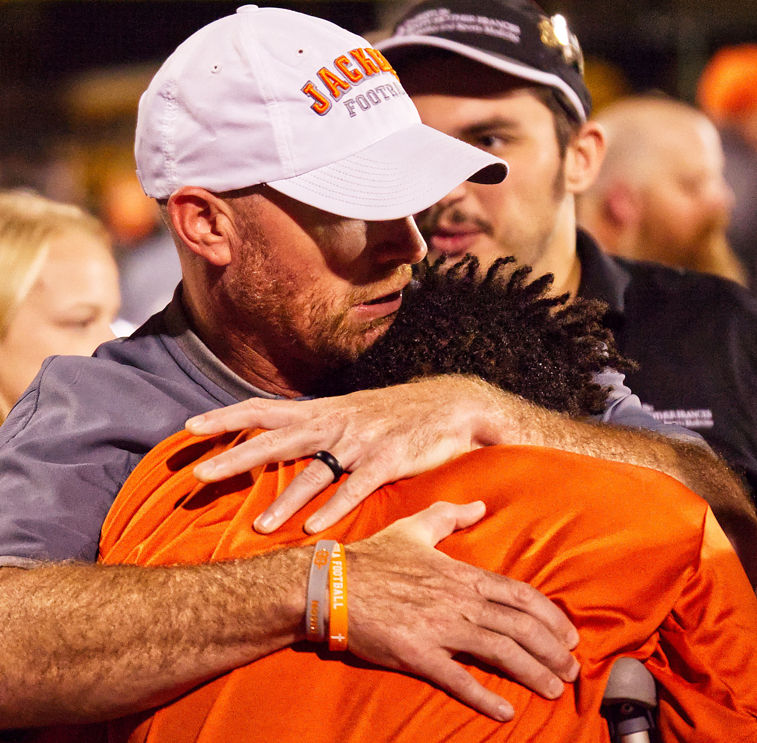 Mineola athletic director Luke Blackwell embraces senior Montrel Williams after a football game Sept. 29 against Big Sandy in which Williams suffered a season-ending injury.